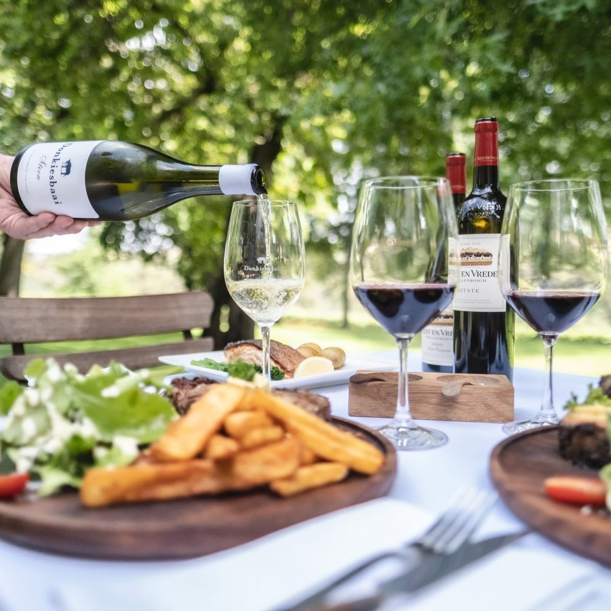 Wine and a long table at an estate